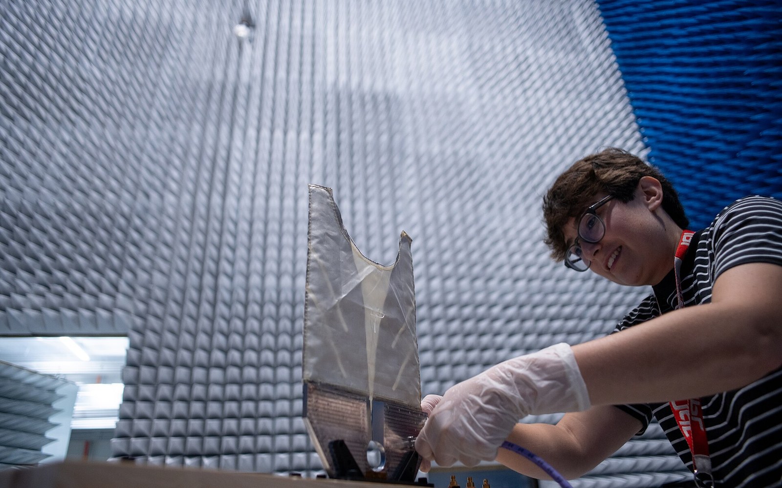 An anechoic chamber's foam wall, cool light