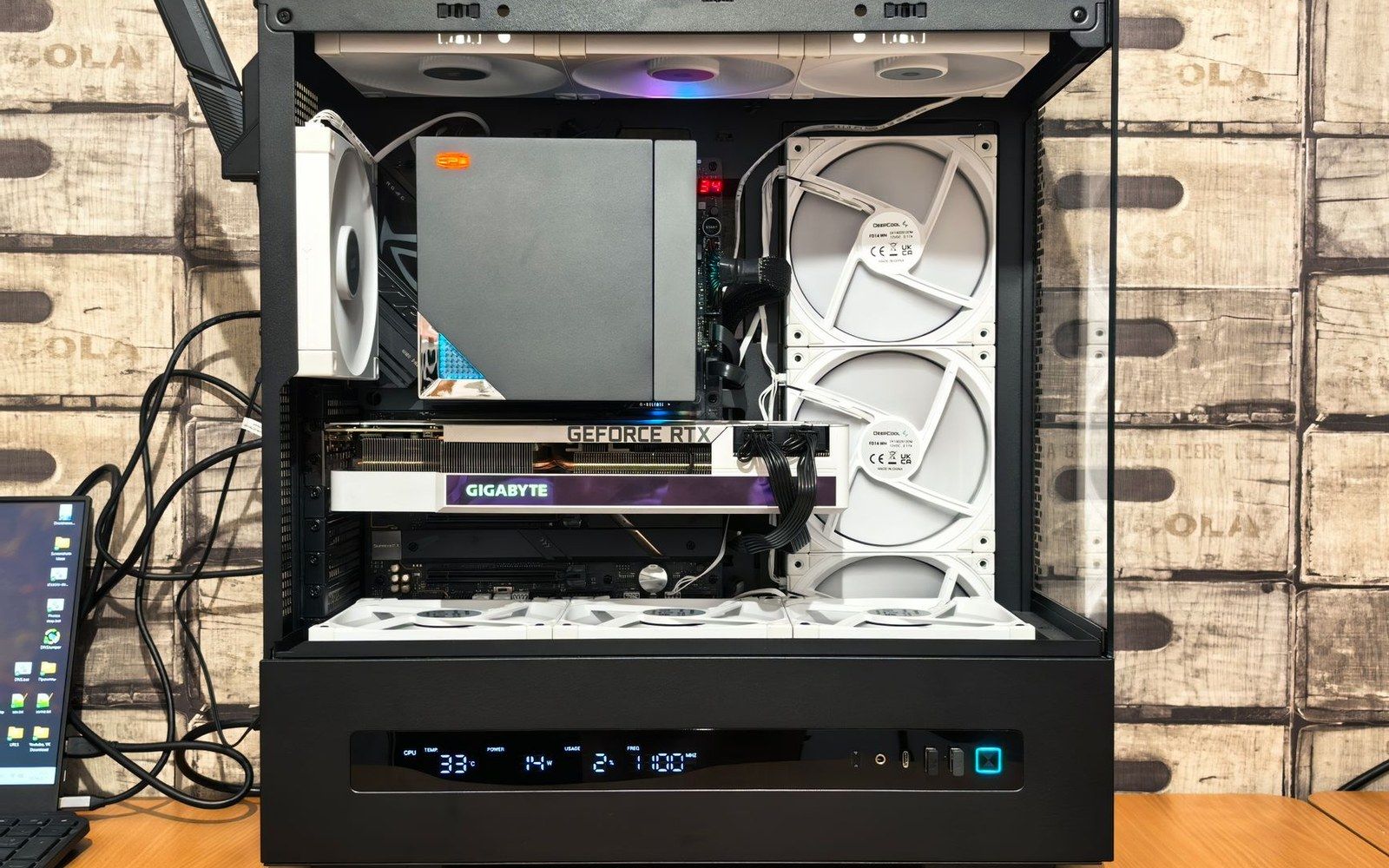 Open-air PC build with a Gigabyte GeForce RTX graphics card and multiple white cooling fans